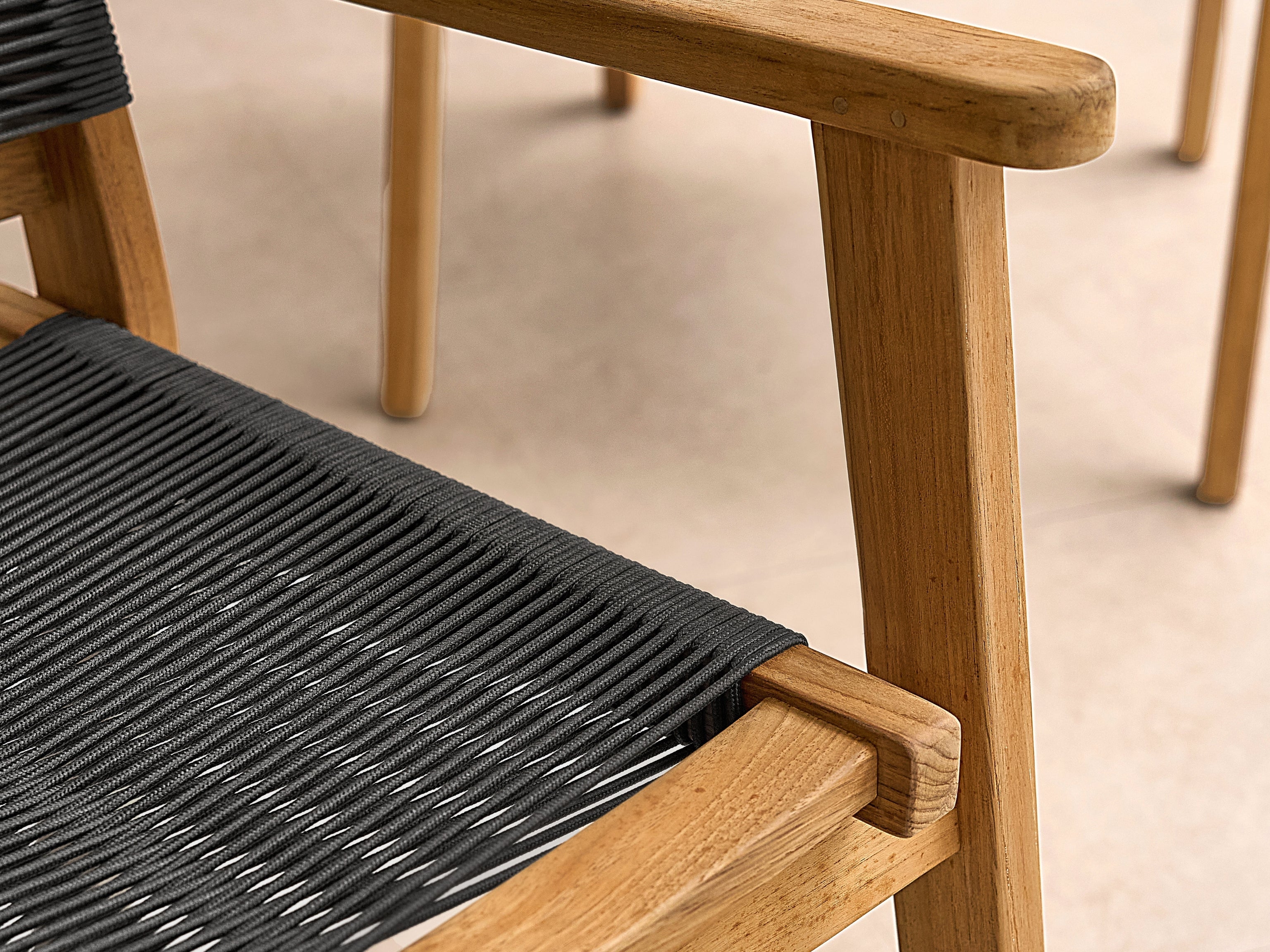 Damien teak and rope dining armchair, angled view