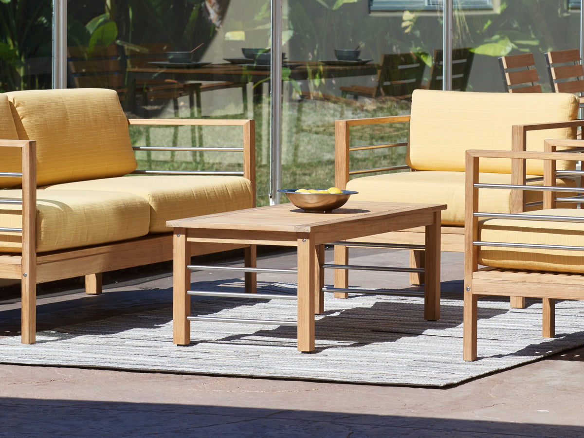 Leon teak coffee table styled in a living setting